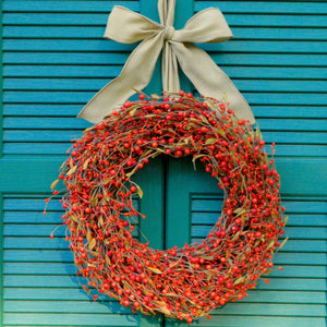 Orange Berry Wreath with Brown Leaves with Bow