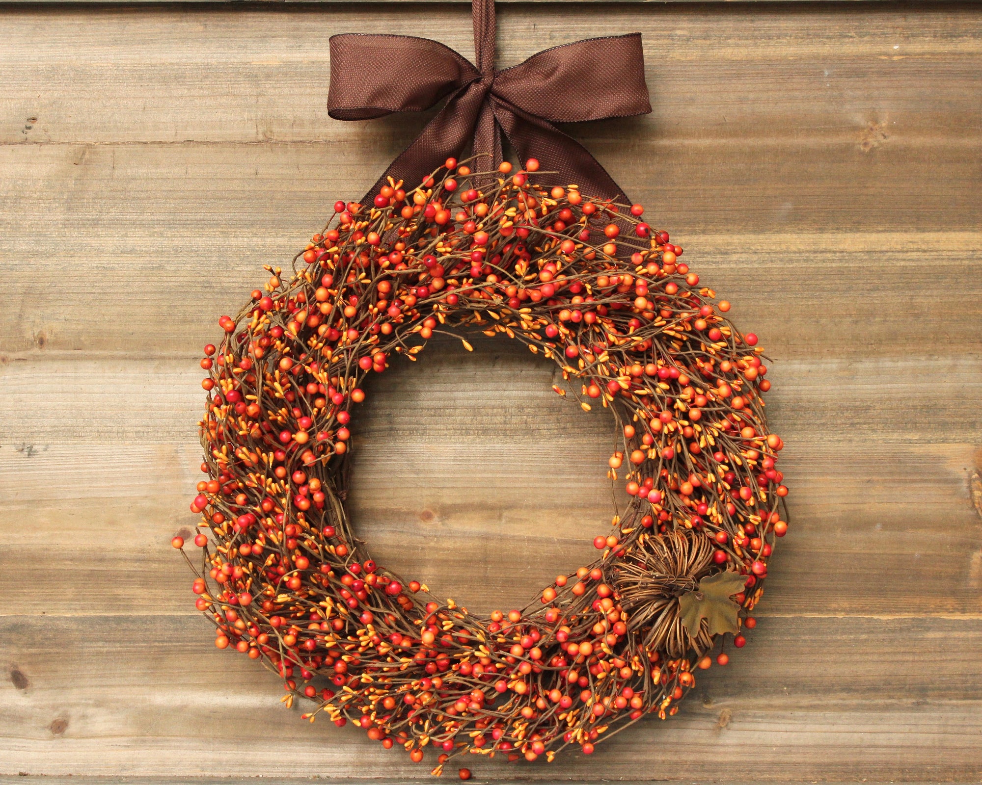Orange Berry Wreath with Grapevine Pumpkin Bow