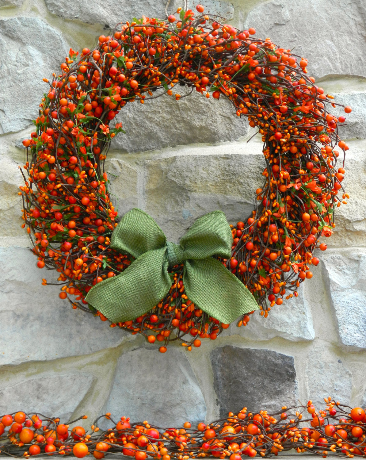 Orange Berry Wreath with Green Leaves and Orange Flowers with Bow