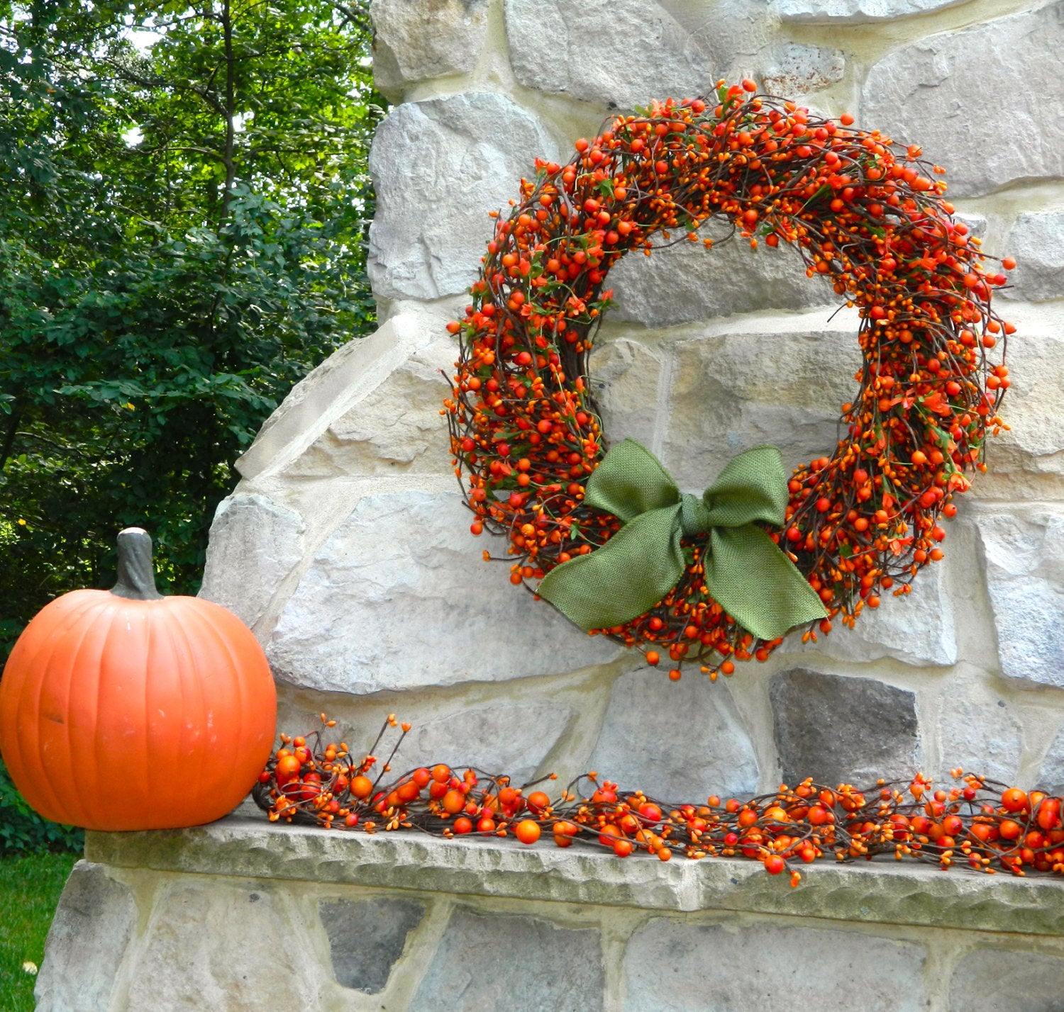 Orange Berry Wreath with Green Leaves and Orange Flowers with Bow